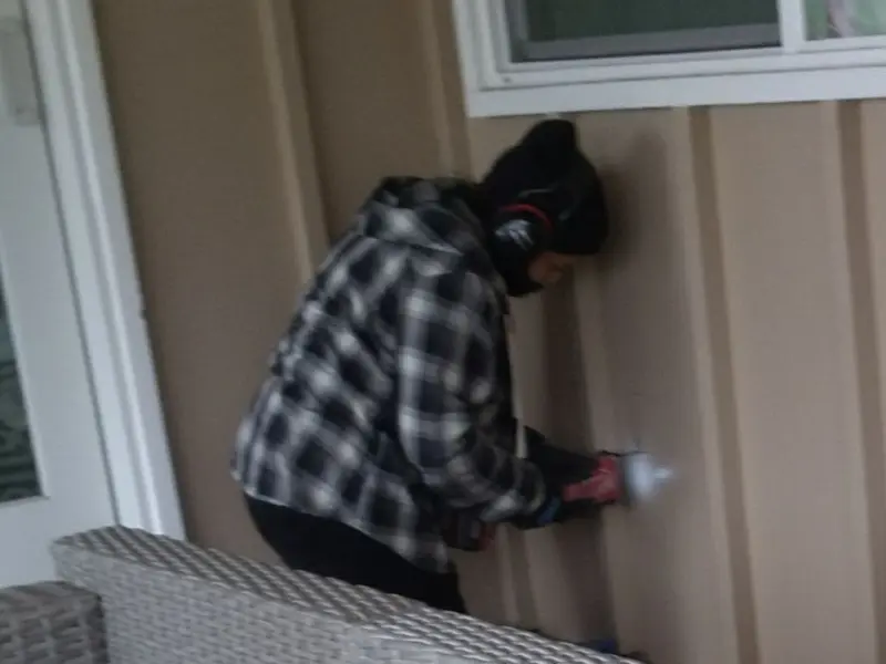 Professional electrician installing an exterior outlet in Brockton