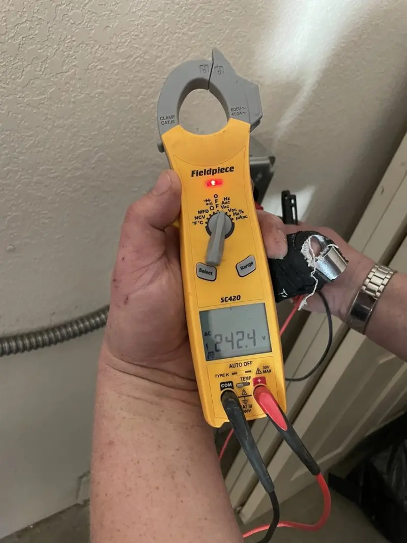 Voltage testing with clamp meter during Outlet Installation in Brockton